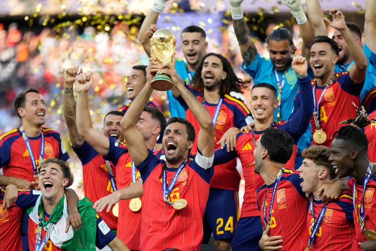 Spain's Rodri celebrates with the trophy after winning the World Cup final soccer match between Spain and Argentina on Sunday.