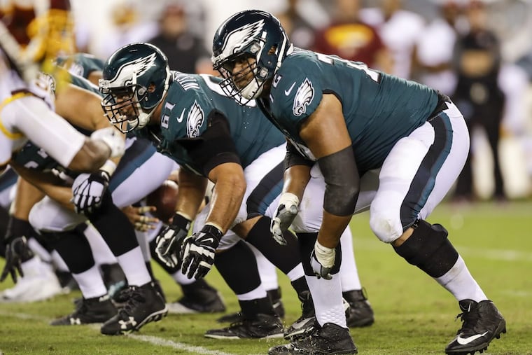 Halapoulivaati Vaitai (right) will start at left tackle Sunday.
