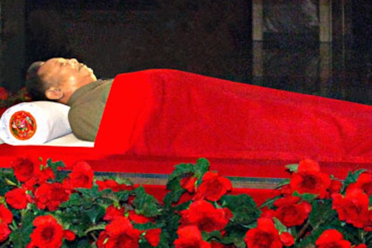 In this photo released by the Korean Central News Agency and distributed in Tokyo by the Korea News Service, the body of North Korean leader Kim Jong Il is laid in a memorial palace in Pyongyang, North Korea, Tuesday, Dec. 20, 2011. Kim died on Saturday, Dec. 17 North Korean state media announced Monday. (AP Photo/Korean Central News Agency via Korea News Service) JAPAN OUT UNTIL 14 DAYS AFTER THE DAY OF TRANSMISSION