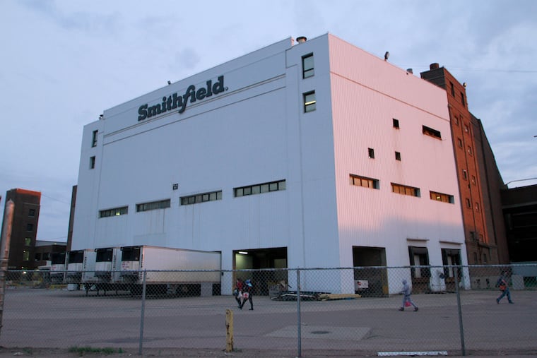 Employees of two departments at the Smithfield pork processing plant in Sioux Falls, S.D. report to work Monday, as the plant moved to reopen after a coronavirus outbreak infected workers.