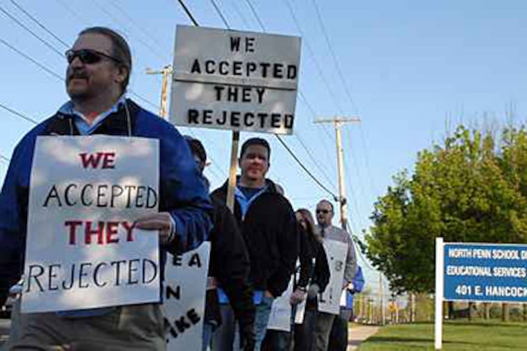 Striking teachers outside the North Penn School District administration building in Lansdale. State law requires 180 school days before June 30. Each missed day adds another to the end of the school calendar. ( Tom Gralish / Staff )