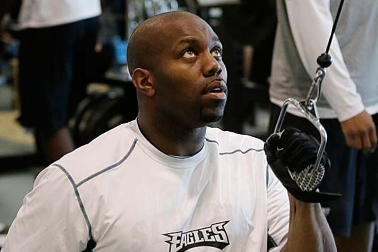 Michael Vick and Trent Cole have little choice but to try to learn Chip Kelly's new tricks. (Matt Rourke/AP)