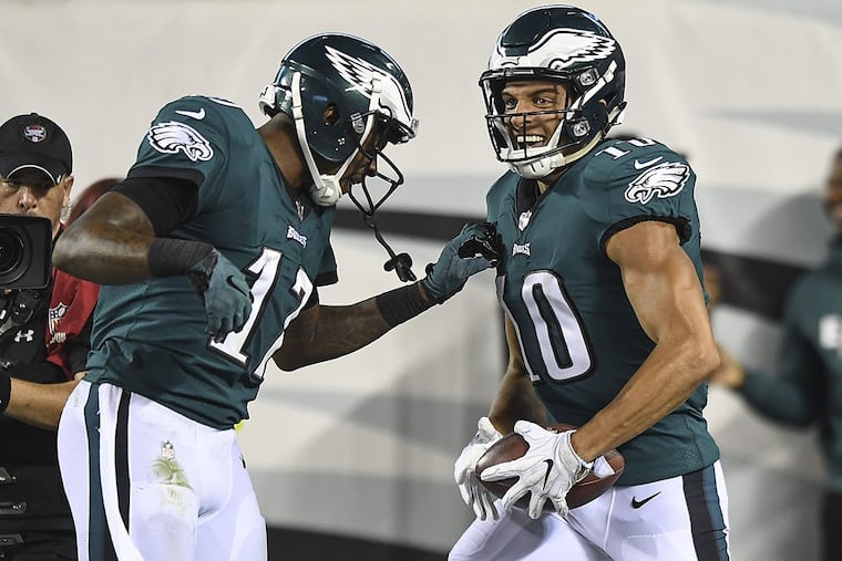 Eagles wide receiver Mack Hollins (right) celebrates his touchdown catch with fellow receiver Alshon Jeffrey.
