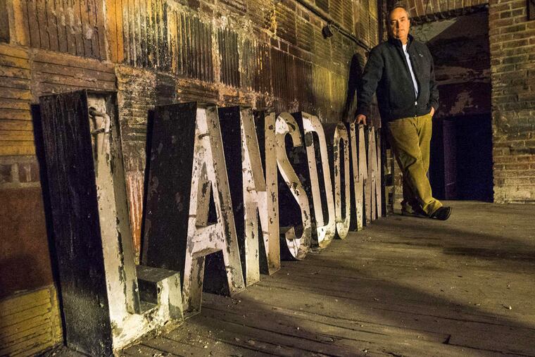 Matt Schultz, Executive Director Historic Lansdowne Theater Corporation, backstage with the original 1927 marquee letters for the theater.