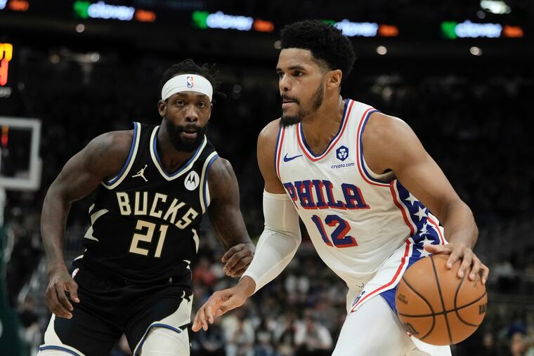 Philadelphia 76ers' Tobias Harris drives by Milwaukee Bucks' Patrick Beverley during the first half of an NBA basketball game Thursday, March 14, 2024, in Milwaukee. (AP Photo/Morry Gash)