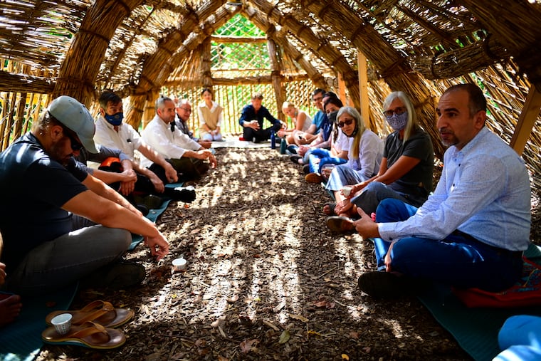 U.S. service members and Iraqi emigres shared traumatic stories of war during "Reconciliation — A Healing Encounter" at the Schuylkill Center for Environmental Education in Philadelphia. The event was held on the 20th anniversary of 9/11 inside a traditional Iraqi guesthouse called a mudhif, part of an art installation at the center.