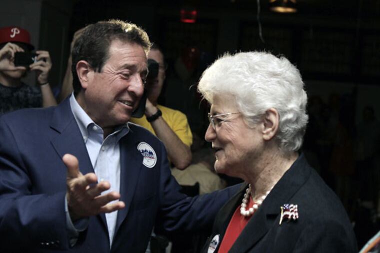 Lynne M. Abraham greets supporters, including lawyer Jon C. Sirlin, on election night at the Olde Bar. “I’m the second woman in 334 years to run for mayor. That’s a disgraceful record,” she said. (ELIZABETH ROBERTSON / Staff Photographer)