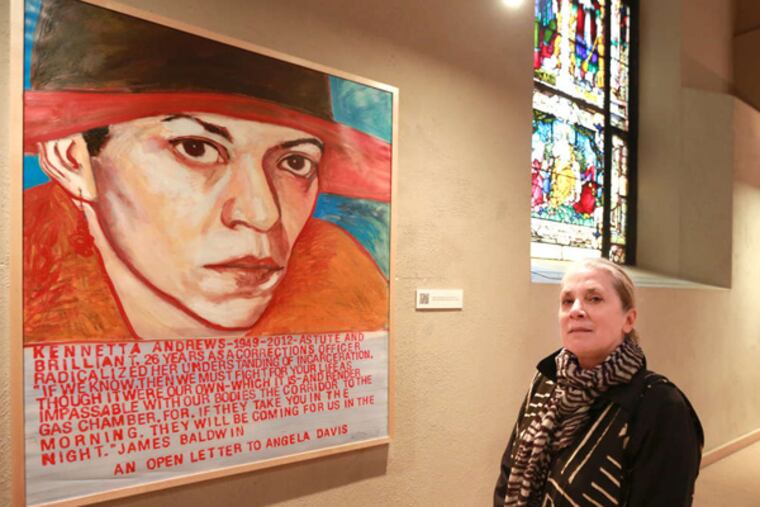 Artist Mary DeWitt, a longtime prison volunteer, with her portrait of inmate Kennetta Andrews.