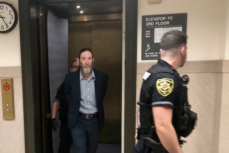 Everett Clayton (center) is escorted into a courtroom Monday in the Montgomery County Courthouse. Clayton is charged with third-degree murder in a fatal crash last year that killed a pregnant woman and her unborn child.