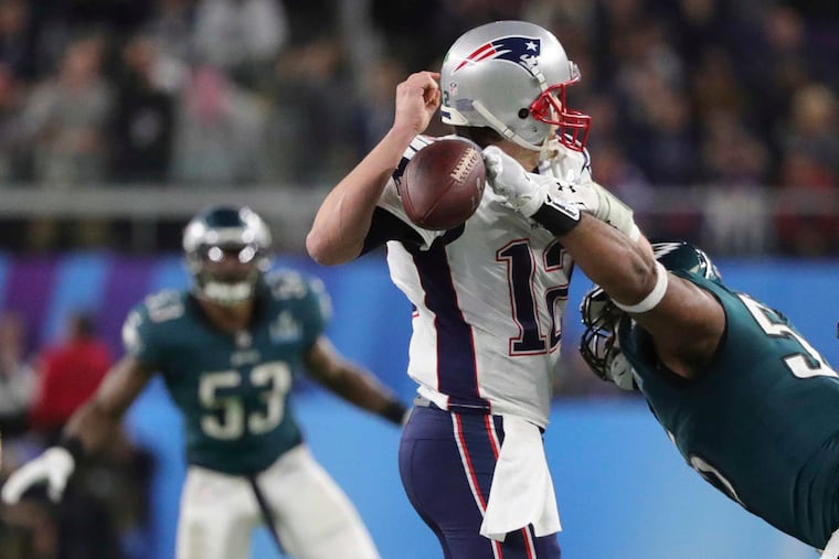 Eagles defensive end Brandon Graham forced a fumble on New England Patriots quarterback Tom Brady during the fourth quarter of Super Bowl LII.