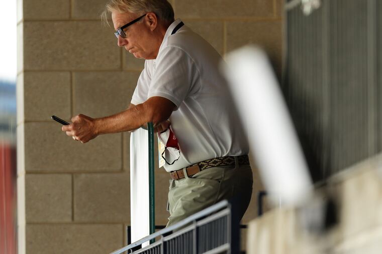 Phillies President Andy MacPhail looks at his phone while the Phillies played the New York Mets on Sunday, August 16, 2020 in Philadelphia.