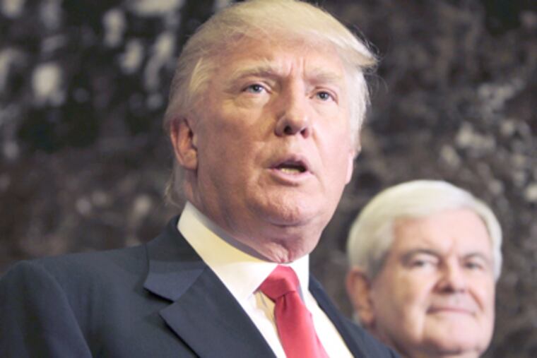 Republican presidential candidate, former House Speaker Newt Gingrich listens at right as Donald Trump talks to media after a meeting in New York on Monday. (AP Photo/Seth Wenig)