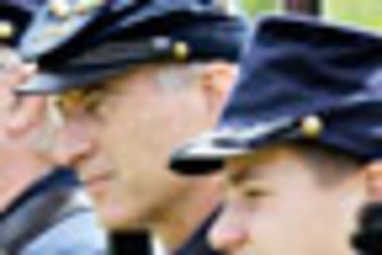 In this June 23, 2012, photo, Civil War reenactors, from left, Tony Pasillas, Steven Hall, John Baker and Colton Evers line up for a shooting drill at Fort Hoskins Historic Park in Rural Benton County, Ore. The group is preparing for a larger battle reenactment next weekend at Willamette Mission State Park near Keizer. (AP Photo/The Corvallis Gazette-Times, Andy Cripe)