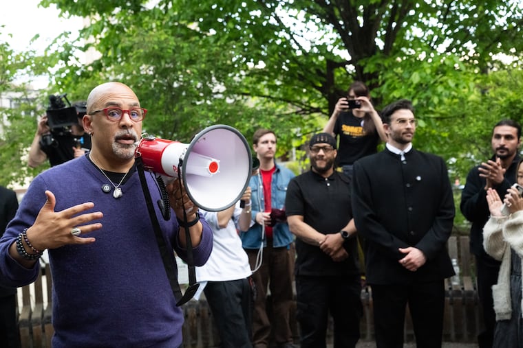 Pa. State Rep. Chris Rabb speaks to attendees while leftist streamer Hasan Piker (right) listens at a fundraiser for Rabb’s 2026 congressional campaign at Renata’s Kitchen in West Philadelphia on Thursday.