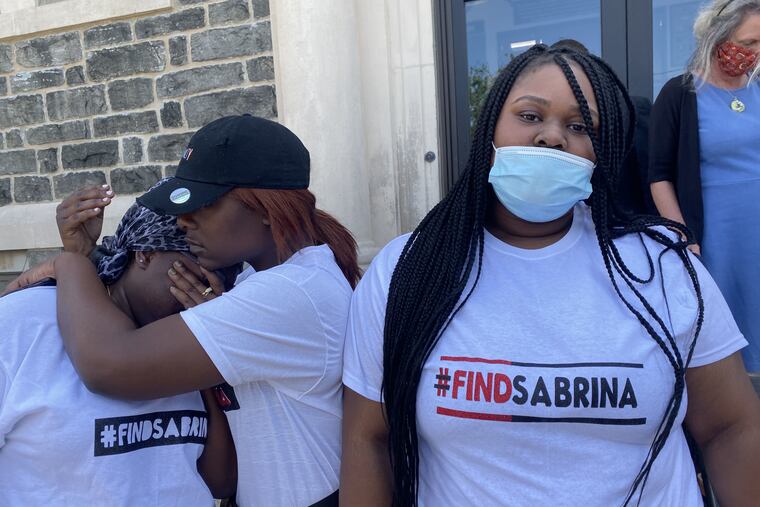 Friends of Sabrina DuBose in front of the Upper Darby Police Department on Wednesday. She had been missing since May 22, and her body was found Tuesday, the day police arrested a suspect in the slaying.