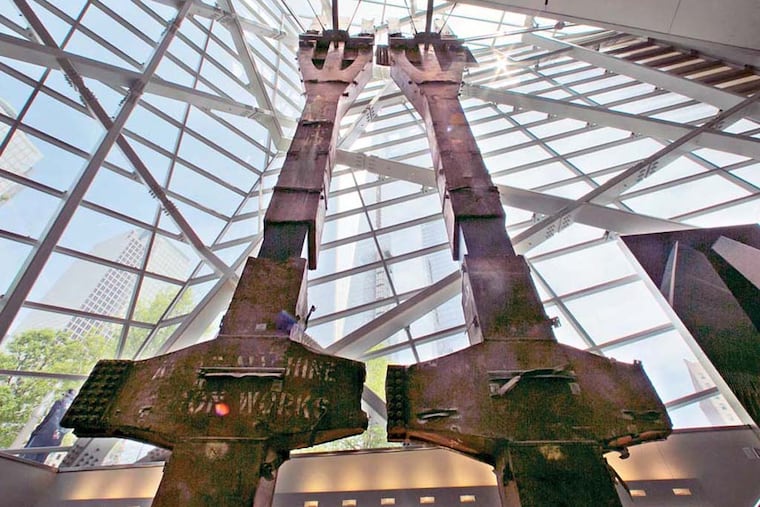 A pair of World Trade Center tridents, that once formed part of the exterior structural support of the east facade of the building, are displayed at the National Sept. 11 Memorial Museum, Wednesday, May 14, 2014, in New York. The museum is a monument to how the Sept. 11 terror attacks shaped history, from its heart-wrenching artifacts to the underground space that houses them amid the remnants of the fallen twin towers' foundations. It also reflects the complexity of crafting a public understanding of the terrorist attacks and reconceiving ground zero. (AP Photo)