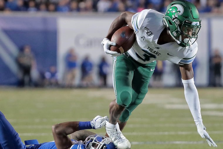 Memphis defensive back T.J. Carter tripping Tulane's P.J. Hall during the teams' game Oct. 19.