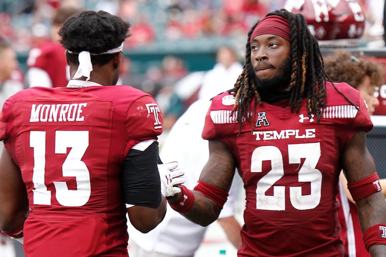 Temple cornerback Harrison Hand (right) slaps hands with safety Ayron Monroe in the final moments of an American Athletic Conference football game against Memphis on Saturday, Oct. 12, 2019, at Lincoln Financial Field. The Owls went on to win, 30-28. LOU RABITO / Staff