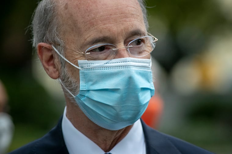 Pennsylvania Governor Tom Wolf with his face mask at a press conference outside the Bucks County Justice Center in Doylestown in September. “No one is immune from COVID. Following all precautions as I have done is not a guarantee," he said when he tested positive.