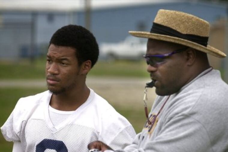 Lindenwold coach Derryk Sellers (right), standing with Dell Robinson at a 2002 practice, is excited to start a new rivalry.