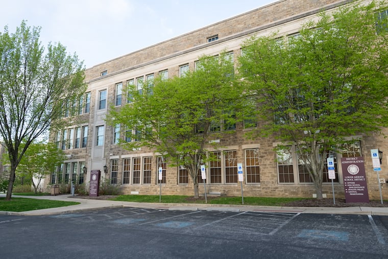 A member of the Lower Merion School Board is accused of embezzling $50,000 from a company where she worked.