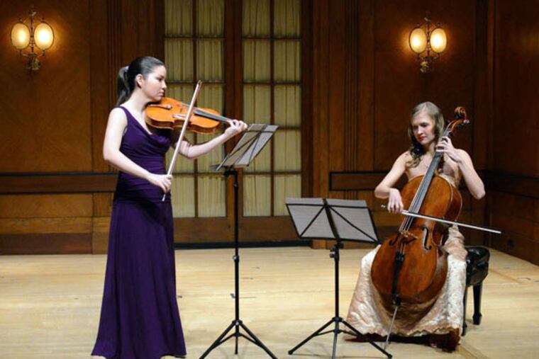 Violist Ren Martin-Doike (left) and cellist Arlen Hlusko perform at Curtis' Field Concert Hall. The exercise professionals at Zarett Rehab & Fitness "really work a lot on posture and preventive measures you can take to strengthen the right muscles," Martin-Doike says. (PETE CHECCHIA)
