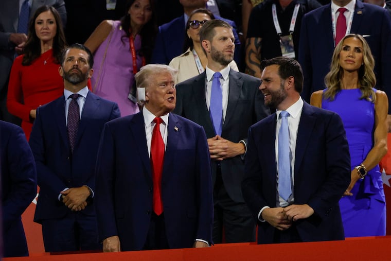 Former President Donald Trump talks with JD Vance, his Vice President candidate, during the first night of the Republican National Convention Monday.