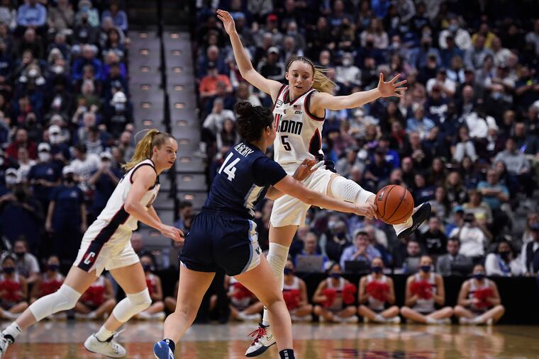Connecticut's Paige Bueckers (5) guards Villanova's Brianna Herlihy (14) in the first half of the Big East final at Mohegan Sun Arena.