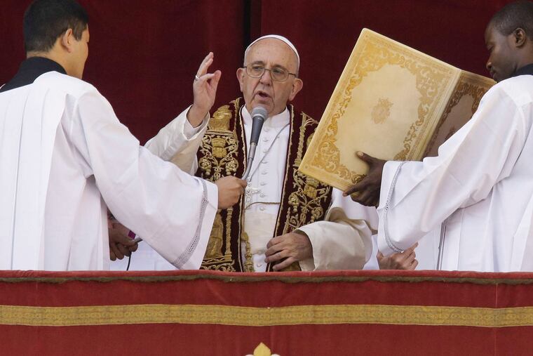 Pope Francis delivers his "Urbi et Orbi" message from the central balcony of St. Peter's Basilica at the Vatican.
