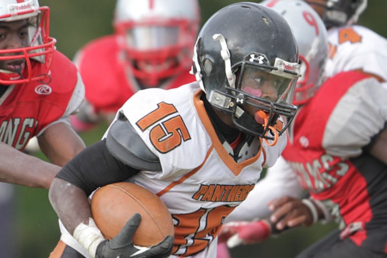 Overbrook's Nasir Mickens (15) runs around the Dobbins defense to
score a two point conversion. (Steven M. Falk/Staff Photographer)