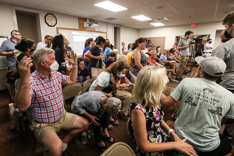 Members of the public leave unhappy after a July 2022 Central Bucks school board vote on a library policy to ban books with "sexualized content."