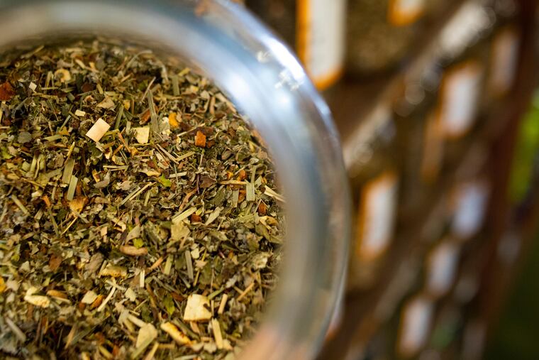 Loose tea leaves fill jars at a store in Missoula, Mont. Tea has been found to have an unexpected health benefit. MUST CREDIT: Tailyr Irvine/For The Washington Post