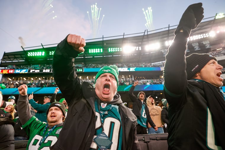 Eagles fans cheer after quarterback Jalen Hurts scores a touchdown during the third quarter of the NFC Championship game against the Washington Commanders on Jan. 26 in Philadelphia. Vocal health expert Robert Sataloff is providing tips for Eagles fans on how to protect their voices while cheering at the upcoming Super Bowl.