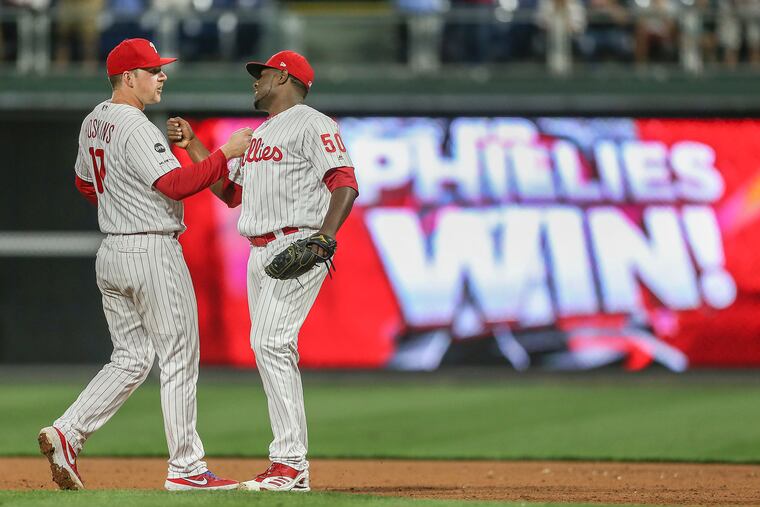 Phillies closer Héctor Neris (right) and first baseman Rhys Hoskins, shown in 2019, had a rough series over the weekend in Atlanta.