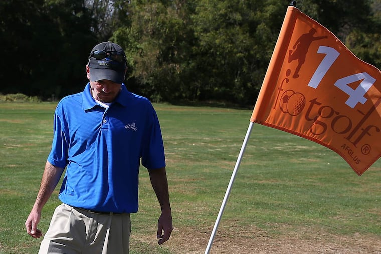 Golf pro Michael Owsik Jr. gives FootGolf a try at the Cobbs Creek golf course in Philadelphia on October 8, 2014. ( DAVID MAIALETTI / Staff Photographer )