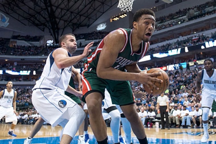 Milwaukee Bucks forward Jabari Parker (12) tries to keep the ball inbounds as Dallas Mavericks guard J.J. Barea (5) defends during the second half at the American Airlines Center. (Jerome Miron/USA TODAY Sports)