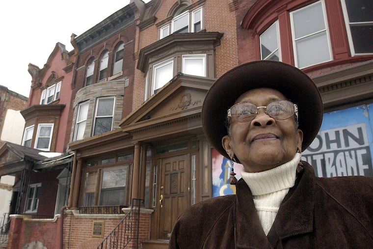 Mary Alexander, John Coltrane's cousin, in front of the John Coltrane house in 2003.