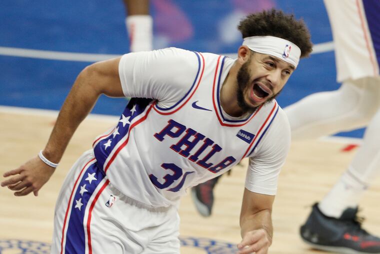 Seth Curry reacts after hitting a three-pointer in the first quarter against the Wizards on Wednesday.