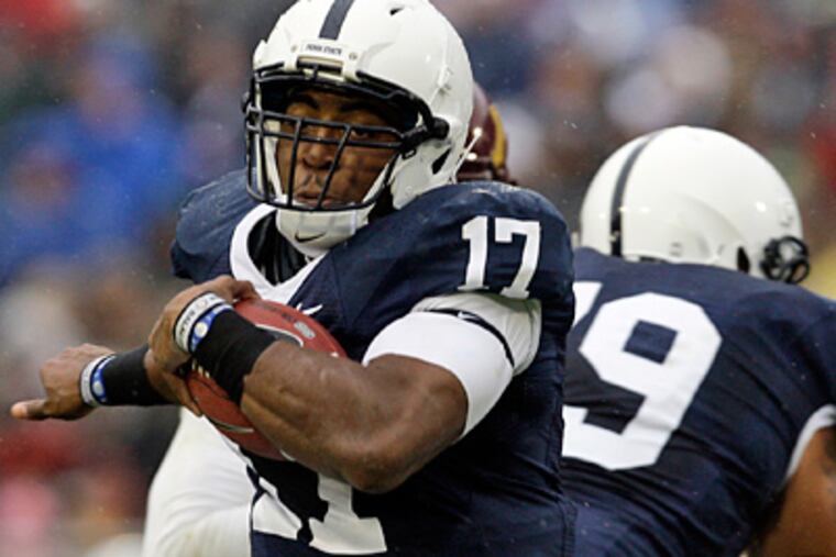 Penn State quarterback Daryll Clark runs with the ball against Minnesota in State College. (AP Photo/Carolyn Kaster)