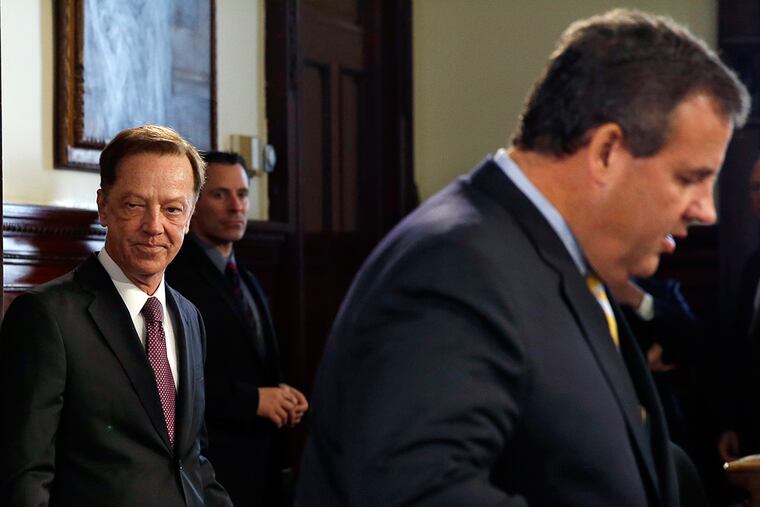 Jamie Fox, left, listens as New Jersey Gov. Chris Christie announces that he has chosen the former top aide to Democratic Gov. Jim McGreevey to be New Jersey's new transportation commissioner Thursday, Sept. 18, 2014, in Trenton, N.J.