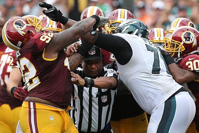 Jason Peters (right) and the Redskins' Chris Baker fight during the fourth quarter. (David Maialetti/Staff Photographer)