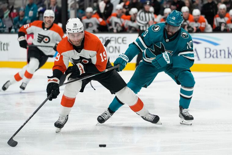 Flyers winger Garnet Hathaway, left, battles Sharks left wing Anthony Duclair for possession of the puck during the second period of their game on Tuesday night.