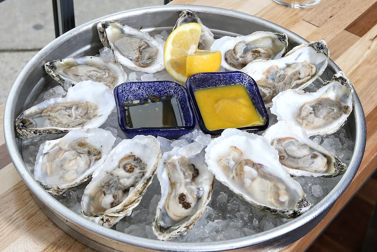 Dogfish "Smoke in the Water" raw smoked oysters on the half-shell with a glass of SeaQuenchAle.
