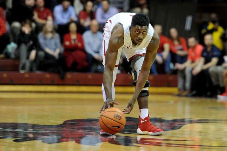 St. Joseph's Shaver Newkirk slows the play down in the final minutes of the game against Dayton.