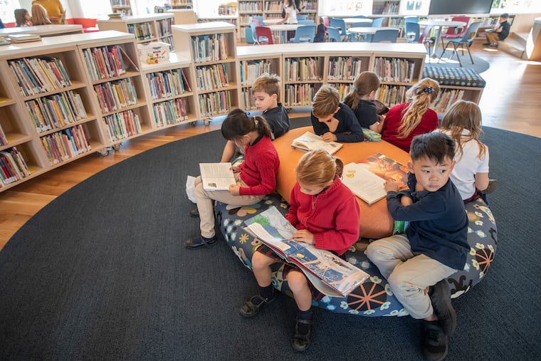 Lower school students congregate at the soft oval reading area which is part of the new $1.5 million, A to Z Library and Learning Commons, at Germantown Academy. The New York-based architecture firm that designed it incorporated elements from students' designs.