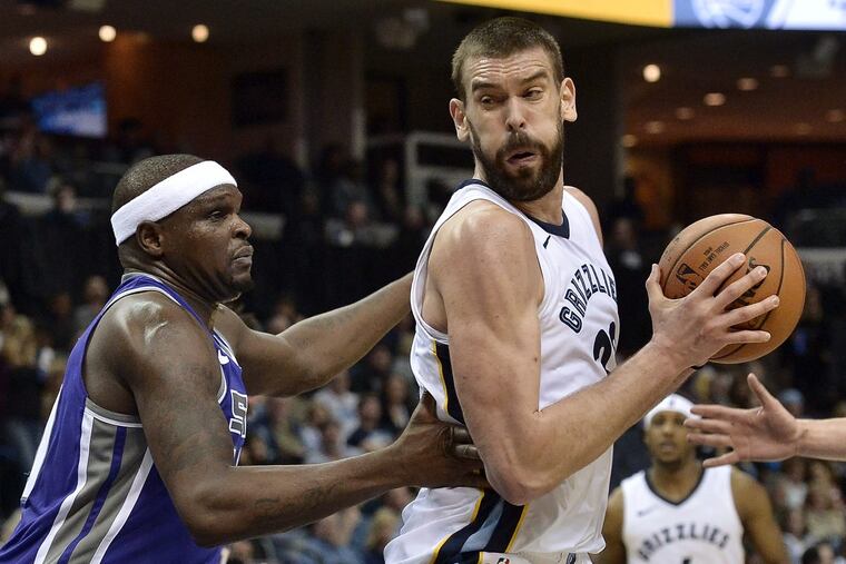 Memphis center Marc Gasol, right, controlling the ball against Sacramento forward Zach Randolph during a game Friday.