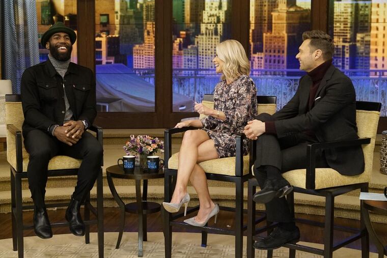 Kelly Ripa and Ryan Seacrest talk with Malcolm Jenkins during the production of "Live with Kelly and Ryan"