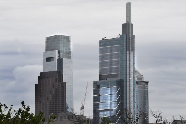 Comcast Center, left, and Comcast Technology Center, rise above the center city skyline in Philadelphia.