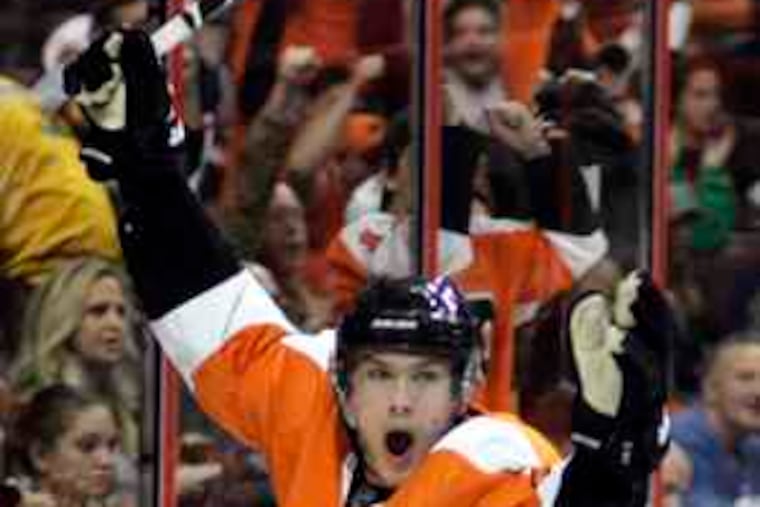 The Flyers' James van Riemsdyk celebrates his second-period goal. He also notched an assist.