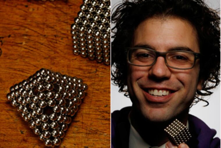 How fun is that? Central High grad Jake Bronstein with shapes composed of his little magnetic spheres.(Michael S. Wirtz / Staff)
